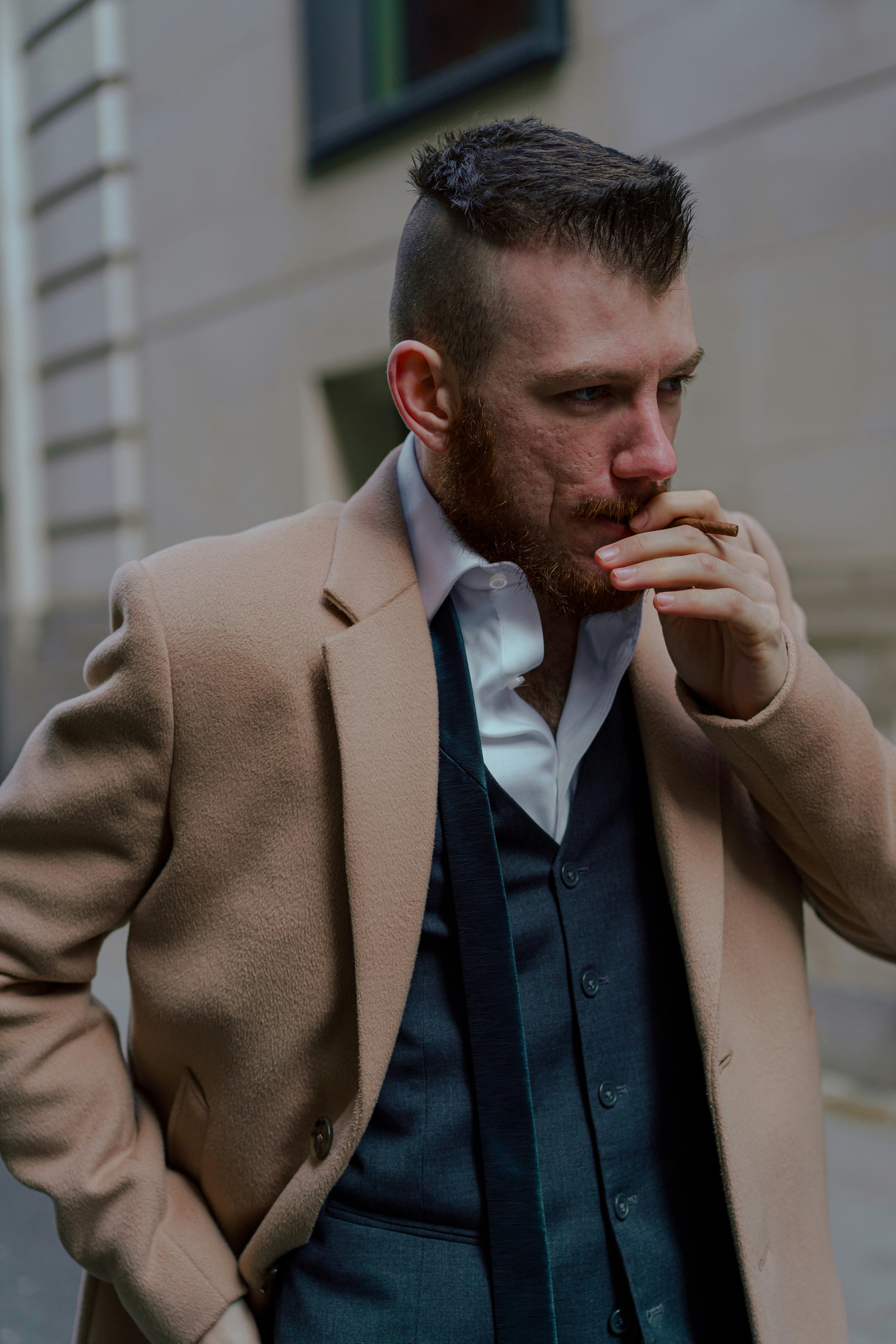 man in brown suit jacket